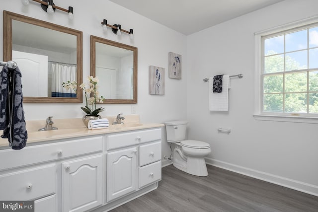 11307 Urieville Ln, Worton, MD 21678 - full bath featuring double vanity, toilet, plenty of natural light, and baseboards