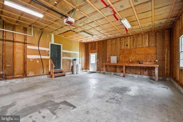 11307 Urieville Ln, Worton, MD 21678 - garage with a garage door opener and a workshop area