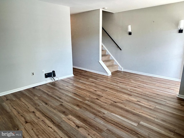 1006 N York Rd Unit 15, Willow Grove, PA 19090 - unfurnished living room with wood finished floors, stairway, and baseboards