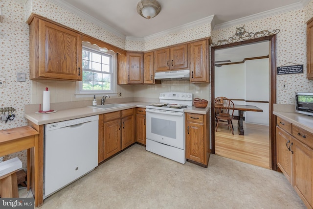 301 Mohawk Dr, Wenonah, NJ 08090 - kitchen with white appliances, a sink, under cabinet range hood, wallpapered walls, and crown molding