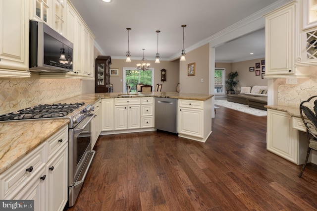 61 Grand Banks Cir, Marlton, NJ 08053 - kitchen featuring appliances with stainless steel finishes, a peninsula, open floor plan, dark wood finished floors, and tasteful backsplash