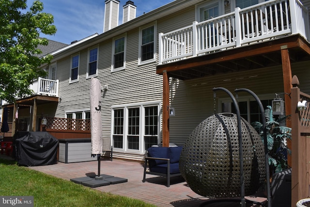 61 Grand Banks Cir, Marlton, NJ 08053 - rear view of house with a balcony, a patio, and a chimney