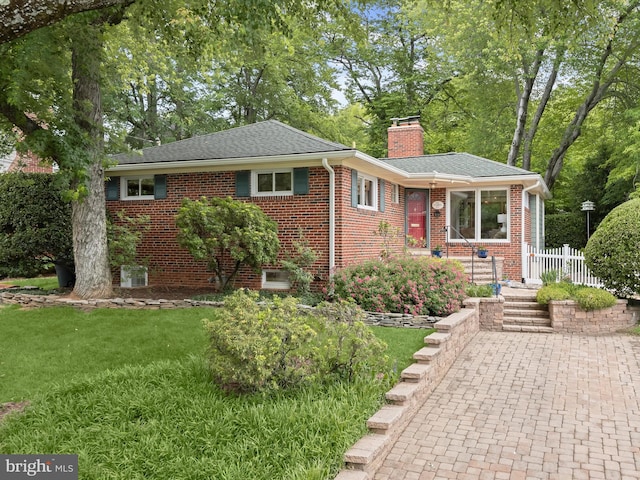 5111 Flanders Ave, Kensington, MD 20895 - view of front of house with a chimney, a shingled roof, and brick siding