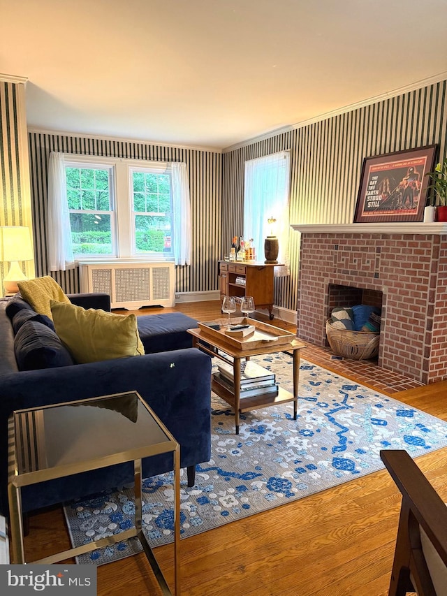 241 Edge Hill Rd, Glenside, PA 19038 - living area with radiator heating unit, wood finished floors, and a fireplace