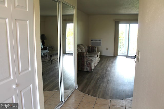 300 Robin Dr Unit 212, Ocean City, MD 21842 - corridor featuring an AC wall unit and wood finished floors