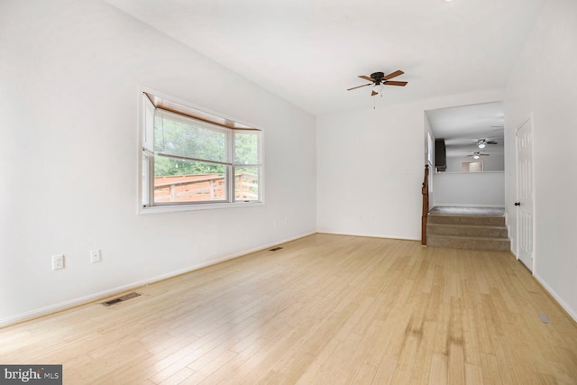 2605 Magdalene Acres Pl, Waldorf, MD 20603 - spare room featuring ceiling fan, stairs, light wood-style floors, and baseboards