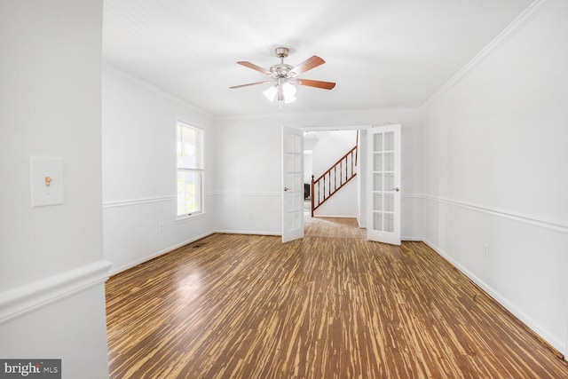 2605 Magdalene Acres Pl, Waldorf, MD 20603 - unfurnished room featuring ceiling fan, wood finished floors, stairway, ornamental molding, and baseboards