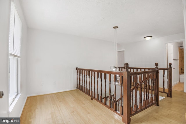 2605 Magdalene Acres Pl, Waldorf, MD 20603 - corridor with an upstairs landing, wood finished floors, healthy amount of natural light, and baseboards