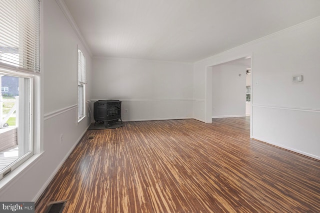 2605 Magdalene Acres Pl, Waldorf, MD 20603 - unfurnished living room with a wood stove, ornamental molding, wood finished floors, and baseboards