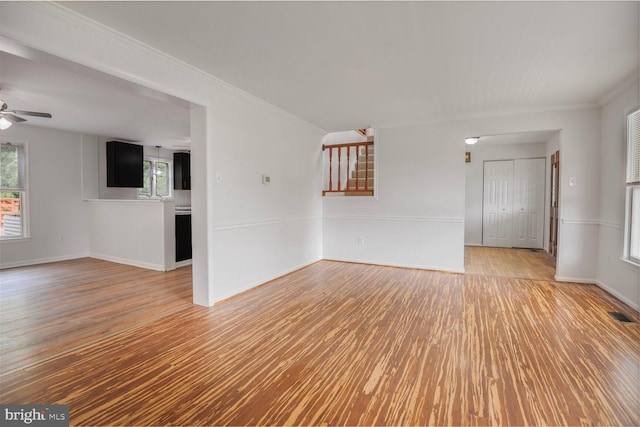 2605 Magdalene Acres Pl, Waldorf, MD 20603 - spare room featuring light wood finished floors, ceiling fan, plenty of natural light, and crown molding