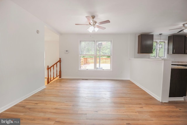 2605 Magdalene Acres Pl, Waldorf, MD 20603 - unfurnished living room with a ceiling fan, light wood-style floors, and baseboards