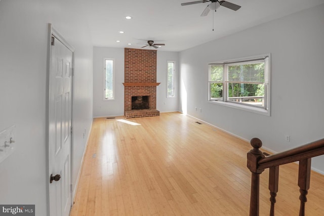 2605 Magdalene Acres Pl, Waldorf, MD 20603 - unfurnished living room featuring a ceiling fan, healthy amount of natural light, baseboards, a brick fireplace, and recessed lighting