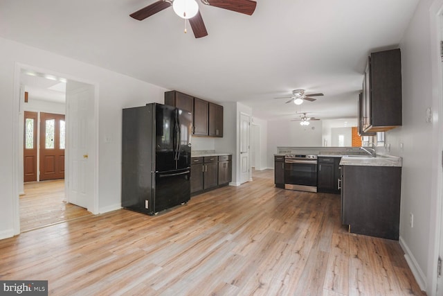 2605 Magdalene Acres Pl, Waldorf, MD 20603 - kitchen featuring freestanding refrigerator, a ceiling fan, stainless steel range with electric stovetop, and light countertops