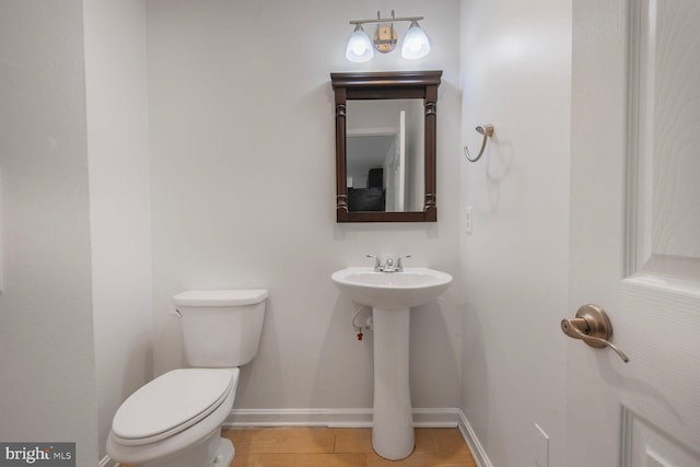 2605 Magdalene Acres Pl, Waldorf, MD 20603 - half bath featuring toilet, baseboards, and a sink