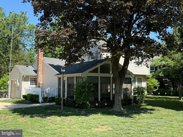 11 Lenape Trl, Wenonah, NJ 08090 - view of front facade featuring a sunroom, a chimney, and roof with shingles