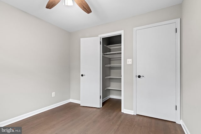 4727 Exeter St, Annandale, VA 22003 - unfurnished bedroom with wood finished floors, a spacious closet, baseboards, and a closet