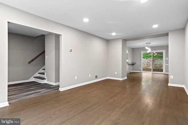 4727 Exeter St, Annandale, VA 22003 - unfurnished living room with dark wood finished floors, stairs, baseboards, and recessed lighting