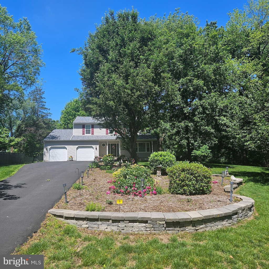 9202 Stone Spring Ln, Pasadena, MD 21122 - view of front facade with driveway and a garage