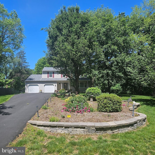 9202 Stone Spring Ln, Pasadena, MD 21122 - view of front facade with driveway and a garage