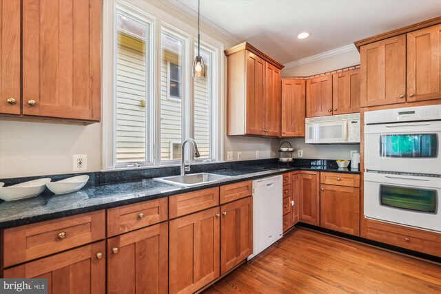 2227 N Albemarle St, Arlington, VA 22207 - kitchen with white appliances, a sink, ornamental molding, light wood-type flooring, and pendant lighting