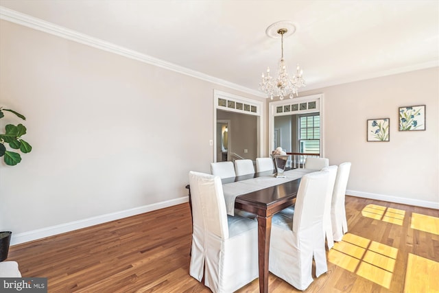 2227 N Albemarle St, Arlington, VA 22207 - dining space with a chandelier, crown molding, baseboards, and wood finished floors