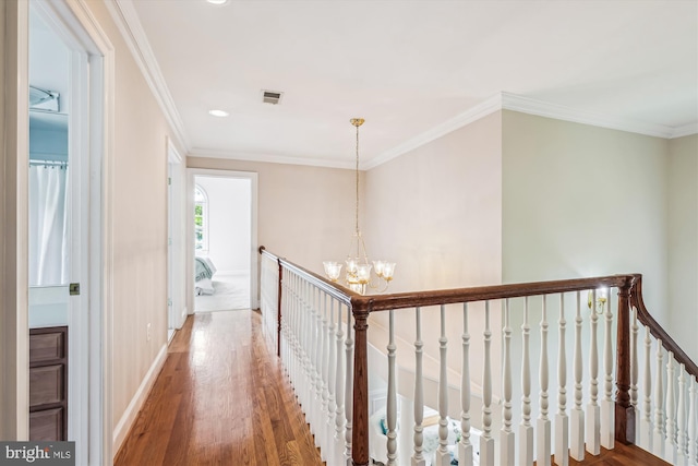 2227 N Albemarle St, Arlington, VA 22207 - hall with an upstairs landing, wood finished floors, a chandelier, ornamental molding, and baseboards