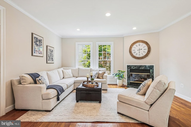 2227 N Albemarle St, Arlington, VA 22207 - living room featuring crown molding, a premium fireplace, baseboards, wood finished floors, and recessed lighting