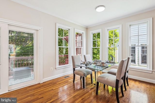 2227 N Albemarle St, Arlington, VA 22207 - dining space with baseboards, ornamental molding, and wood finished floors