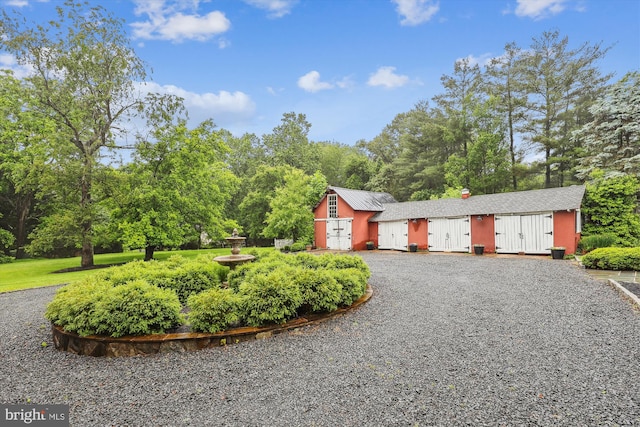 2740 Hunter Mill Rd, Oakton, VA 22124 - view of front facade with view of scattered trees and driveway