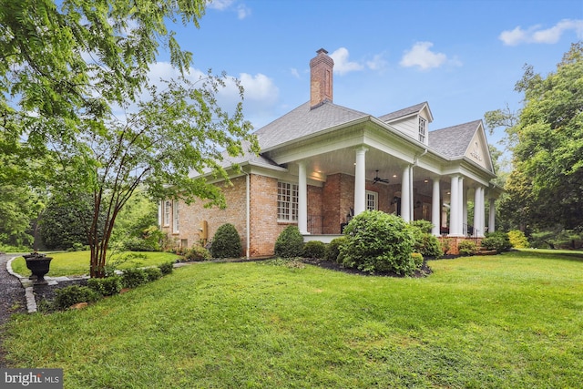 2740 Hunter Mill Rd, Oakton, VA 22124 - view of side of home with ceiling fan, a yard, brick siding, and roof with shingles