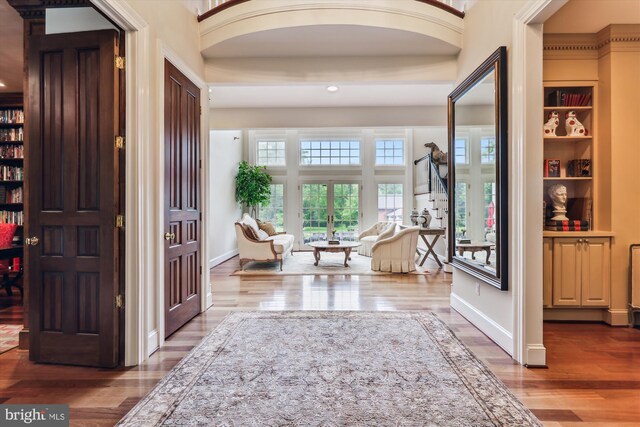 2740 Hunter Mill Rd, Oakton, VA 22124 - entrance foyer featuring arched walkways, wood finished floors, recessed lighting, and baseboards