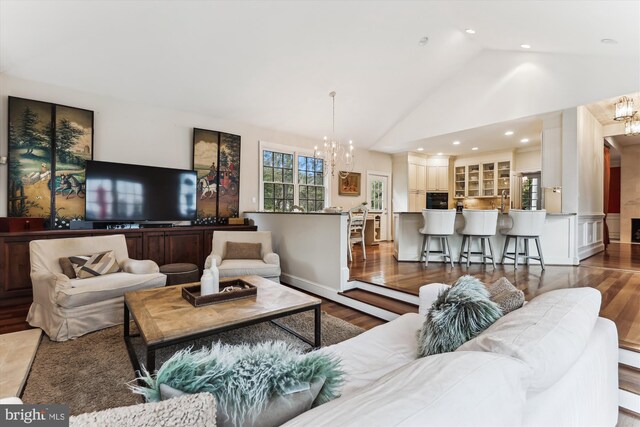 2740 Hunter Mill Rd, Oakton, VA 22124 - living area with a chandelier, wood finished floors, high vaulted ceiling, and recessed lighting