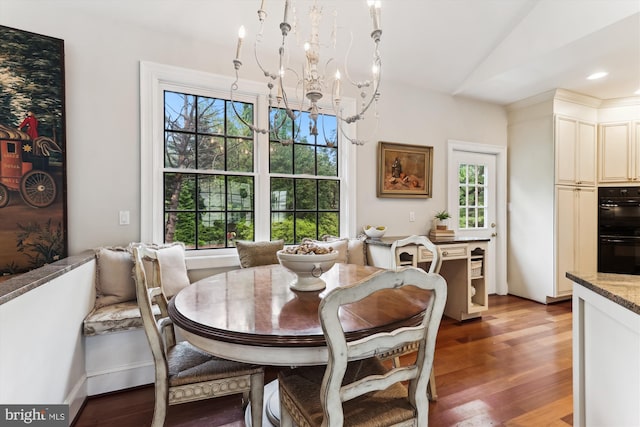 2740 Hunter Mill Rd, Oakton, VA 22124 - dining room featuring a chandelier, wood finished floors, and lofted ceiling