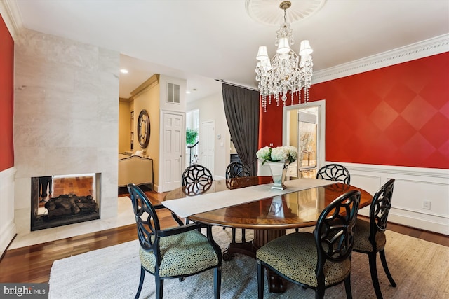2740 Hunter Mill Rd, Oakton, VA 22124 - dining area featuring wood finished floors, a chandelier, ornamental molding, and recessed lighting