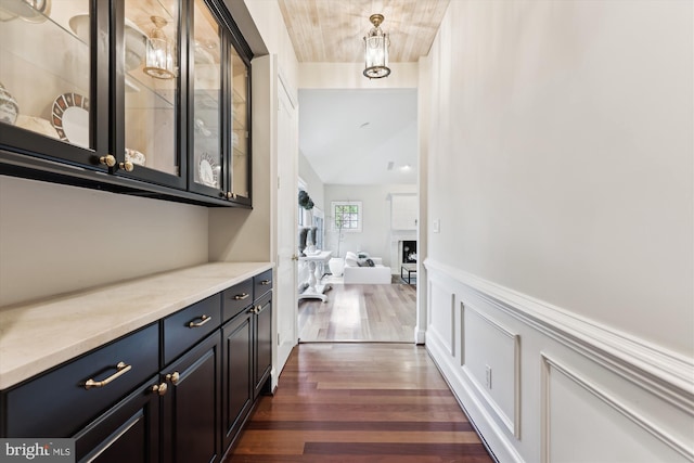2740 Hunter Mill Rd, Oakton, VA 22124 - corridor with dark wood-style flooring and wainscoting