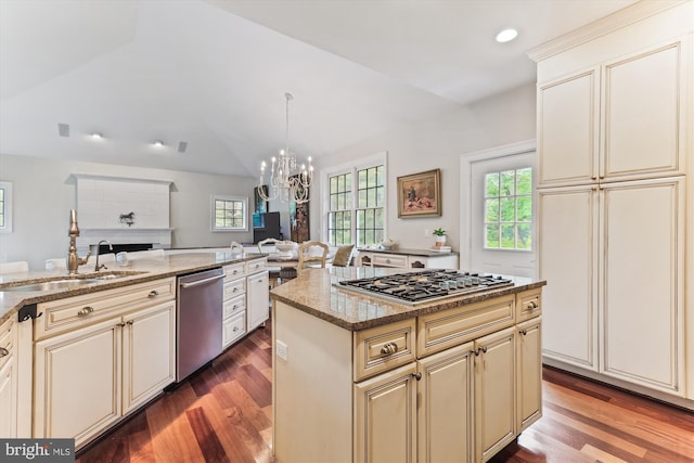 2740 Hunter Mill Rd, Oakton, VA 22124 - kitchen featuring stainless steel appliances, cream cabinets, a sink, vaulted ceiling, and recessed lighting
