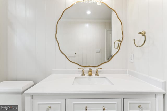 2740 Hunter Mill Rd, Oakton, VA 22124 - bathroom with vanity, toilet, a decorative wall, and ornamental molding