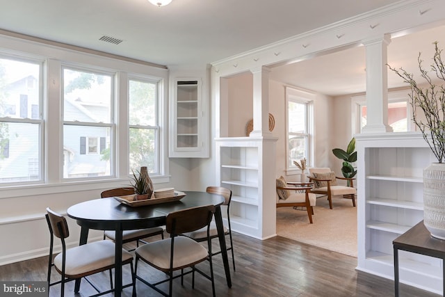 147 N Spruce St, Elizabethtown, PA 17022 - dining room featuring decorative columns, dark wood finished floors, plenty of natural light, and baseboards