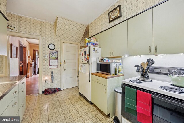 324 Cameron Rd, Willow Grove, PA 19090 - kitchen with range with electric cooktop, stainless steel microwave, freestanding refrigerator, wallpapered walls, and light flooring