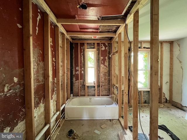 2554 Frederick Ave, Baltimore, MD 21223 - bathroom featuring plenty of natural light and a bathtub