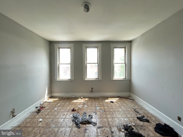 2554 Frederick Ave, Baltimore, MD 21223 - empty room featuring healthy amount of natural light and baseboards