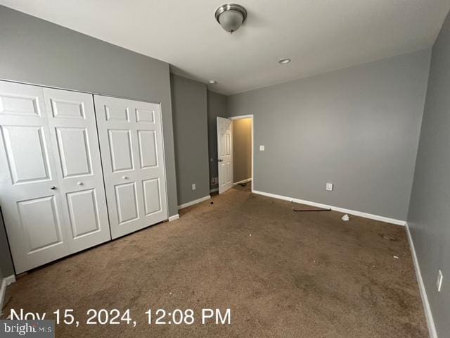 2468 Greenmount Ave, Baltimore, MD 21218 - unfurnished bedroom with carpet, baseboards, and a closet
