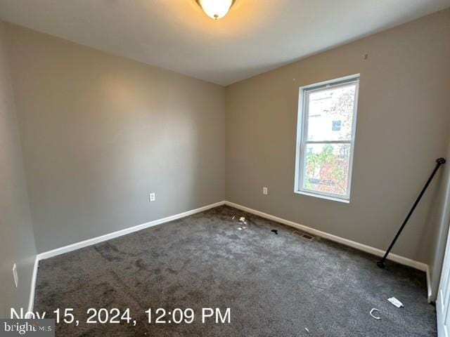 2468 Greenmount Ave, Baltimore, MD 21218 - spare room featuring carpet flooring and baseboards
