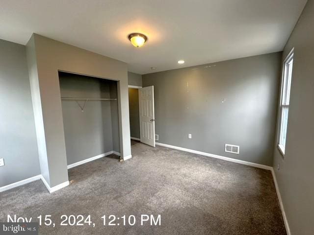 2468 Greenmount Ave, Baltimore, MD 21218 - unfurnished bedroom featuring baseboards and carpet floors