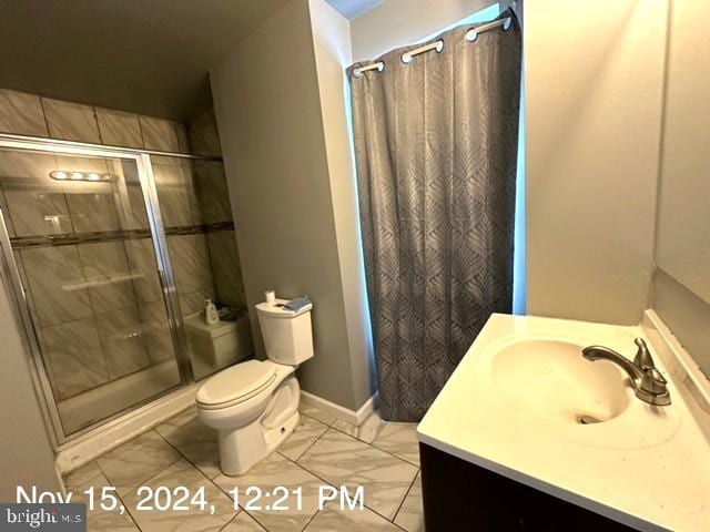 2468 Greenmount Ave, Baltimore, MD 21218 - bathroom with vanity, a stall shower, toilet, and baseboards