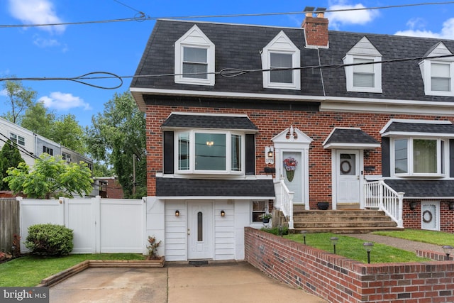 3778 Westhampton Dr, Philadelphia, PA 19154 - townhome / multi-family property featuring a shingled roof, brick siding, a chimney, and mansard roof