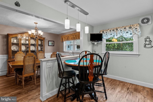 3778 Westhampton Dr, Philadelphia, PA 19154 - dining area featuring a chandelier, wood finished floors, plenty of natural light, wainscoting, and baseboards