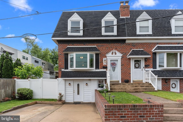 3778 Westhampton Dr, Philadelphia, PA 19154 - townhome / multi-family property featuring a shingled roof, mansard roof, brick siding, and a chimney