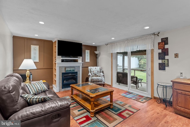 3778 Westhampton Dr, Philadelphia, PA 19154 - living area featuring a tile fireplace, light wood-type flooring, baseboards, and recessed lighting