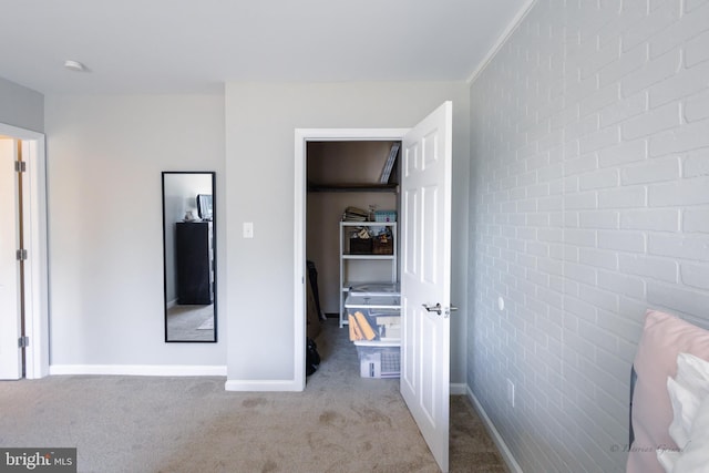 5143 Venice Ave, Hammonton, NJ 08037 - bedroom with carpet floors, baseboards, a walk in closet, and brick wall